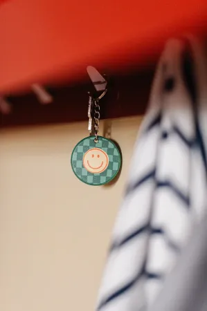 Sfeerfoto sleutelhanger Smile – Geel – D40mm – PVC sleutelhanger met lachgezicht